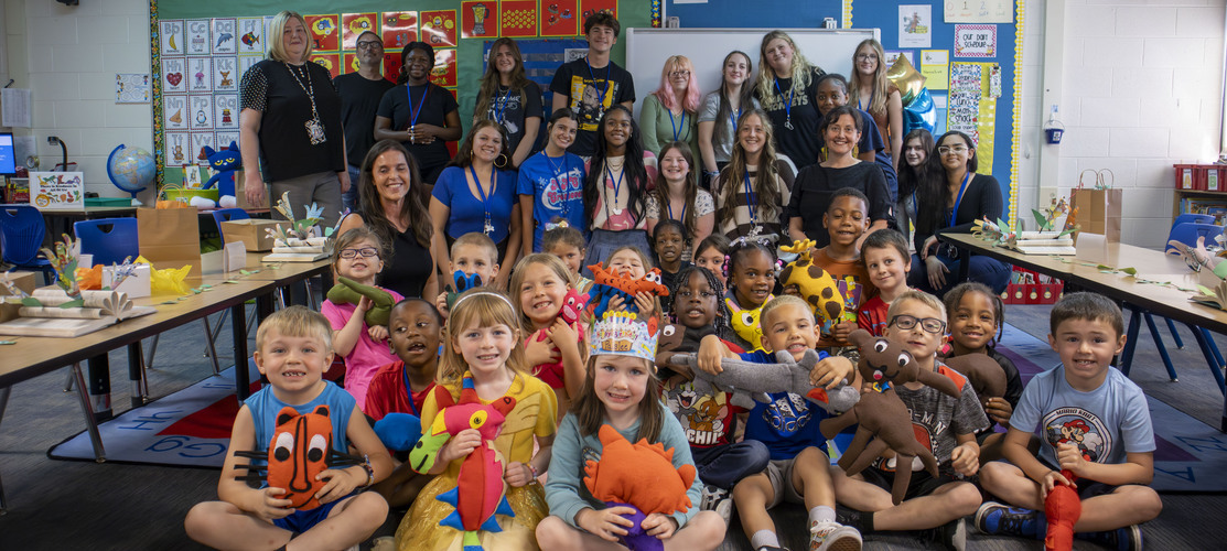 L'Anse Creuse High School students and Graham Elementary kindergartners together for group project.