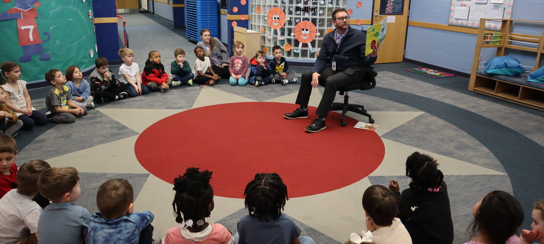Reading to preschool students at the Early Childhood Center