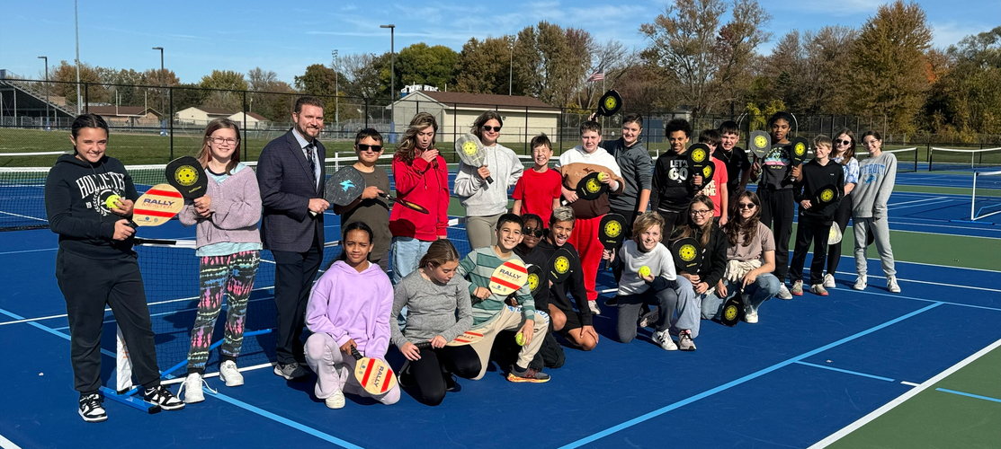 Keith Howell playing pickleball with Middle School - Central students.